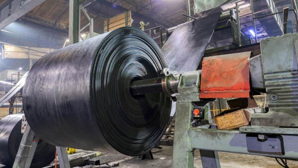 Interior of a factory for manufacturing rubber conveyor belts.